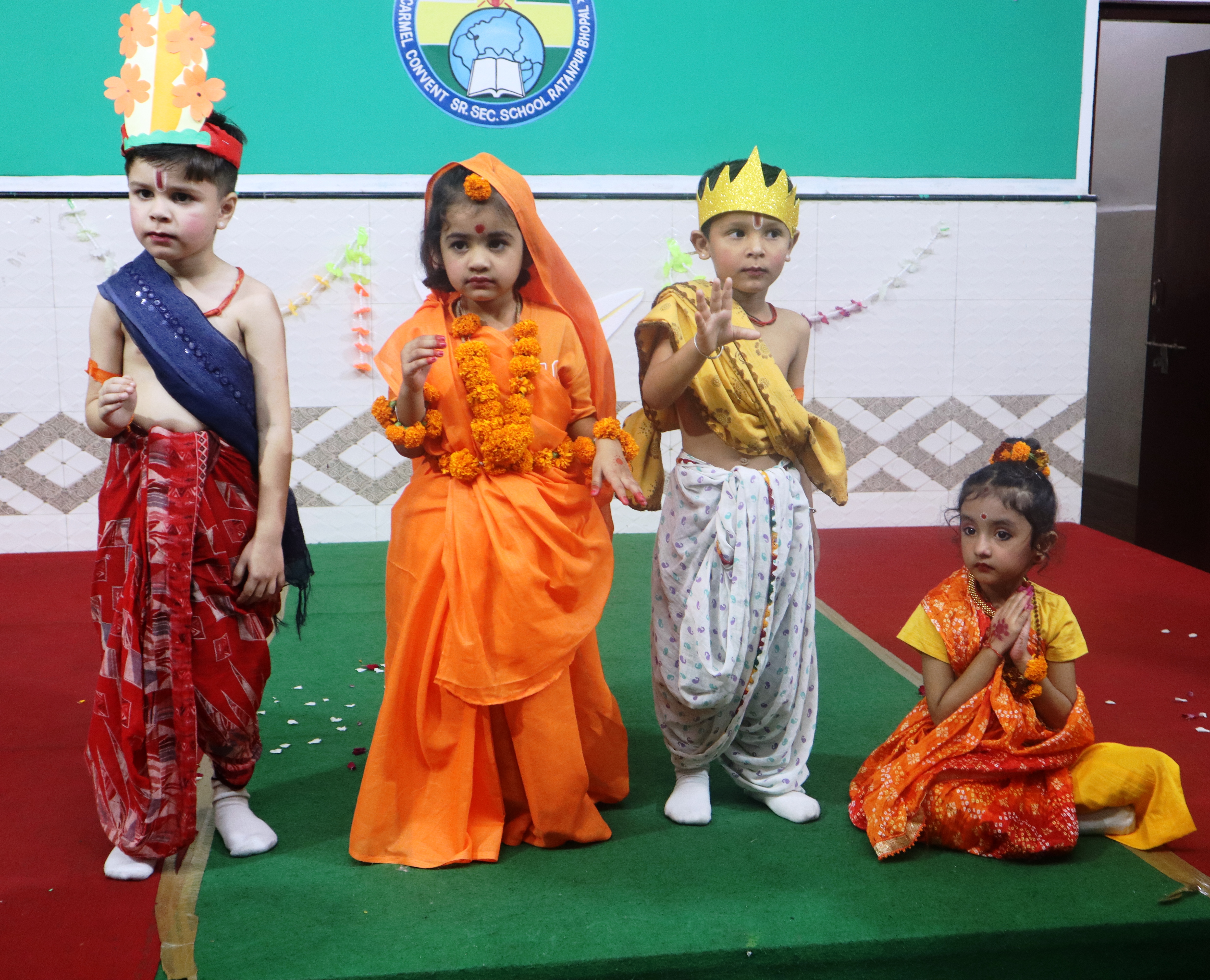 Children in costume performing a festival play on stage